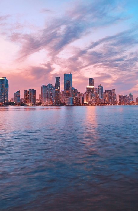 Downtown Miami skyline at sunset seen across Biscayne Bay